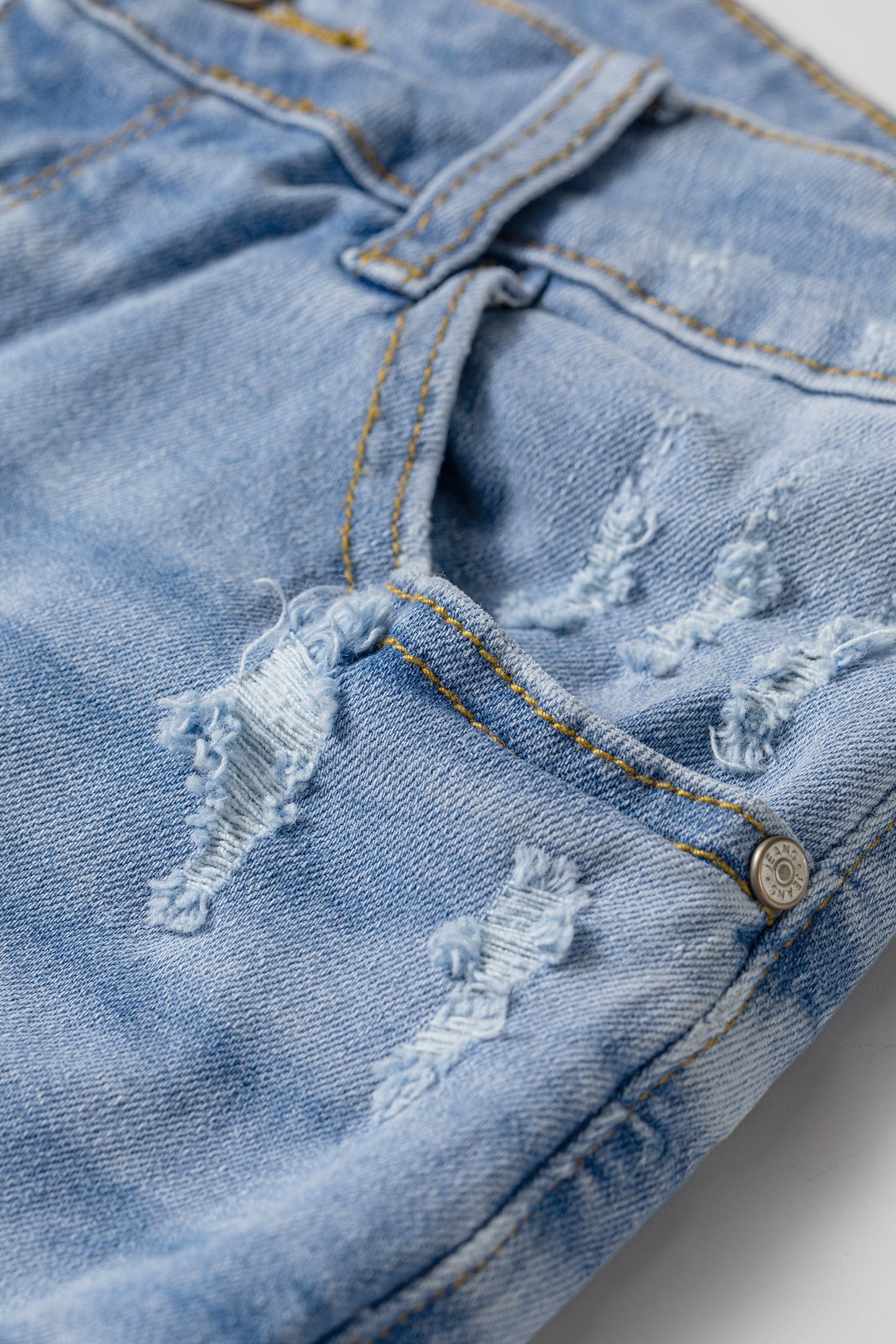 Beau Blue Asymmetric Raw Hem Distressed Whiskery Denim Shorts